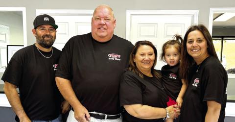 Members of the Stanford family — Marcus (l-r), Jeff, Kandy, Ansley and Amber — in the body shop office after the business reopened last week. DEBBIE LURIE-SMITH/Staff