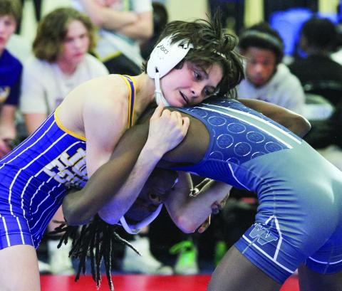 Landon Lewis gets leverage during Saturday’s consolation semifinal. BRAD HARRISON/Staff