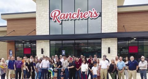 Jones County showed up for the May 19 ribbon-cutting celebrating the opening of Rancher’s, located at 615 Landmark Pointe Blvd. in Gray. The 7,000-squarefoot convenience store and fueling station opened it doors to customers May 18. Rancher’s is owned by Dylan and TJ Heath (center). The store is the third business in phase one of Landmark Point, following Scooter’s Coffee Shop and Suds Bucket Car Wash. For more information about Rancher’s, call 478-607-2484. DEBBIE LURIESMITH/Staff