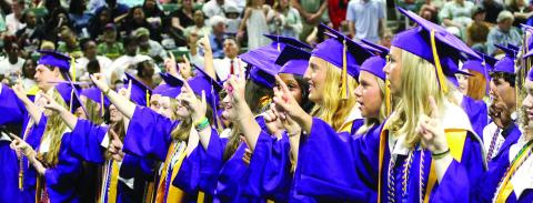Students join in the singing of Jones County High School’s “Alma Mater” at the 2025 graduation ceremony held at Milledgeville’s Centennial Center. BRAD HARRISON/Staff