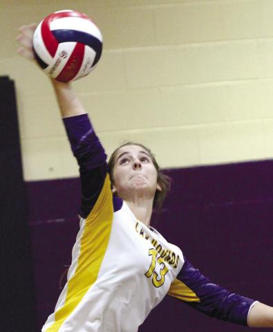 Kylie Chastain serves the ball over the net last week against Mary Persons. BRAD HARRISON/Staff