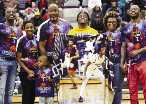 Daethan Harris, center, was among the basketball seniors honored during Friday’s Senior Night festivities at the JCHS Gymnasium. SEE FULL COVERAGE IN SPORTS >> PAGE C1 CONTRIBUTED