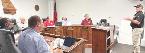Jones County Fire Chief Thomas Coleman (far right) speaks to the Board of Commissioners at work session April 1 with an ISO update and improvement ideas. DEBBIE LURIE-SMITH/Staff
