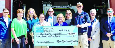 Pictured are (l-r):Alex Smith – MB, Tracy McSwain – MB, Casey Gallagher – MB Community Foundation, Captain Heather Johnson – GFD, Brian Utley – MB, Amy Peacock – MB, Leslie Pennington – MB Community Foundation, Firefighter Lee Faircloth – GFD, Kim Fowler – MB, Chris White – MB.