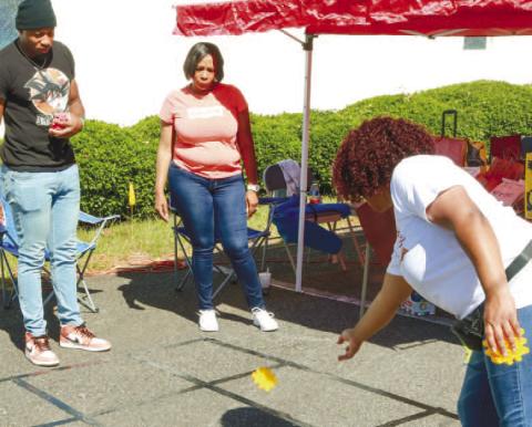 Attendees compete in one of the games at the fall festival at St. James AME Church Oct. 15. NATHAN CLARKE/Contributed