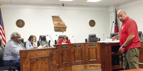 Jones County Chief Tax Appraiser Tony George (right) speaks to the Board of Assessors. He also faced tough questions from commissioners in the same room throughout the Fall. FILE PHOTO