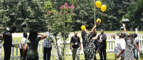 A release of 12 balloons from family members who are descendants of the family in honor of their passed loved ones.