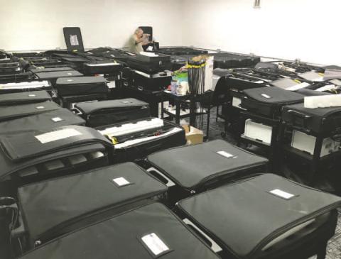 The elections office does not have enough room to both store and work on the equipment, which is spread out in three locations. DEBBIE LURIE-SMITH/Staff