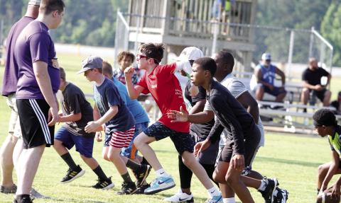 Young players learn basics at football fundamentals camp