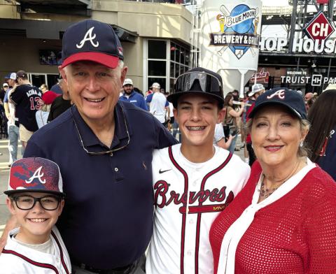 Al and Nancy Andrews at a Braves game recently with grandsons Cooper (left) and Rowdy. CONTRIBUTED