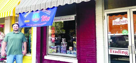 Chris Jameson, the owner of CJ’s Cards and Collectibles, outside of his shop in Milledgeville.