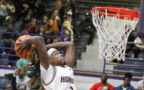 Jaylen Sanford hammers down a slam dunk during Saturday’s win against Northeast.