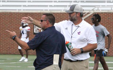 Incoming JCHS athletic director Chad Alligood (left) on the field in August with head football coach Mike Chastain.