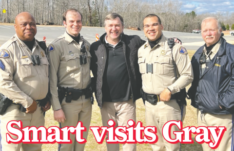 University of Georgia head football coach Kirby Smart (center) made a stop at Jones County High School Friday to visit several talented Greyhounds less than a week after winning back-to-back National Championships. Some of Jones County’s finest – deputies Boisey Hunt (l-r), Patrick Bloodworth, Lt. Wesley Ransom and Deputy Mike Pruitt – met the coach while checking out who was landing a helicopter on the JCHS campus. CONTRIBUTED
