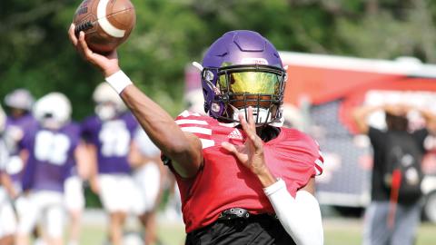 Greyhounds quarterback Devin Edmonds zings a pass during last week’s on-field work. BRAD HARRISON/Staff