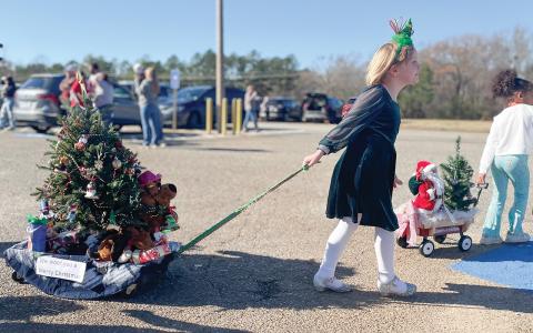 First graders work with their families outside of class to create creative floats that celebrate the season and others that reflect students’ interests. 