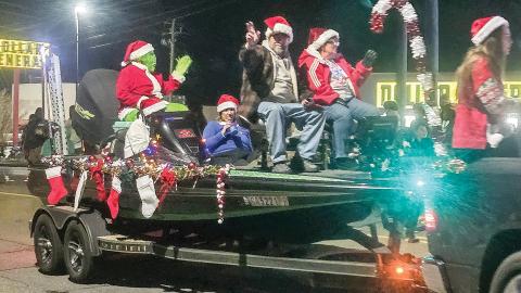 Grand Marshals Joe Partenza and Rhonda Hart greeted the crowd from a fishing boat during last week’s Gray Christmas Parade.