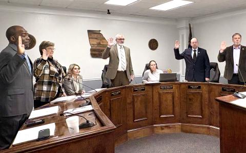 Jones County commissioners take their oaths of office from Probate Judge Lewis Patterson.