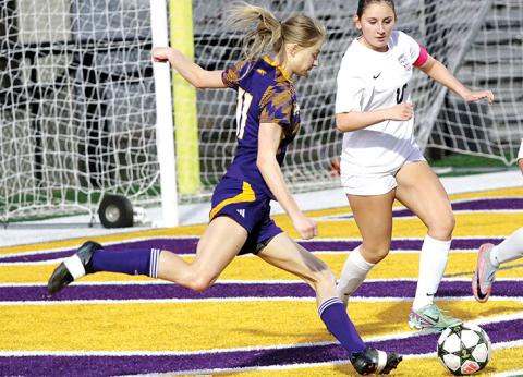 Daisy Blanton rips a hard shot toward the net against Union Grove. BRAD HARRISON/Staff