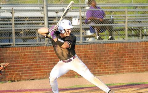 Noah Robinson waits to put his bat on the ball last Wednesday against McDonough. The Greyhounds beat the Warhawks twice last week by a combined score of 42-5.