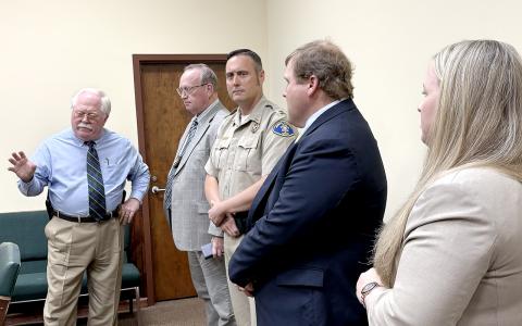 Putnam County Sheriff Howard Sills (far left) is investigating the shooting of a suspect by a Jones County deputy.