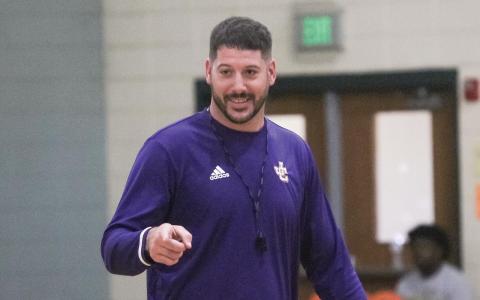 Greyhounds head coach Dylan Dupree gives instructions during last week’s first day of summer workouts.