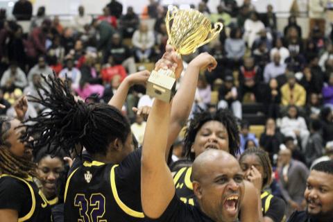 The Lady Greyhounds celebrate at center court after winning their second region title in a row on Friday in McDonough.