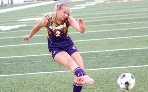 Caroline Rickman rifles a shot toward the net during last week’s home win against Hampton. BRAD HARRISON/Staff