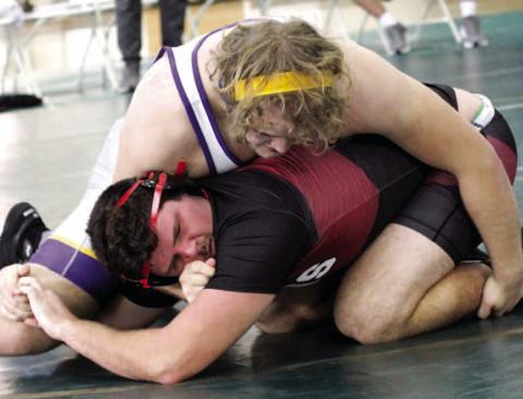 Will Agudelo pins his opponent from Warner Robins down in Saturday’s opening region duals match. BRAD HARRISON/Staff