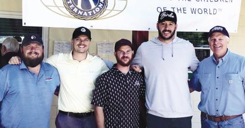 Shown are first-place tournament winners being congratulated by Charles Newberry on the right.