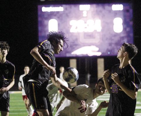 The Greyhounds’ back line converges to turn away a second-half scoring try by GMC Prep. BRAD HARRISON/Staff