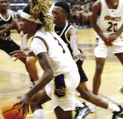 Jaylen Sanford overcame foul trouble to make key baskets near the end on Saturday against Westside, scoring 15 points. BRAD HARRISON/Staff