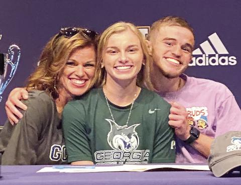Kimber Kent poses after signing a letter of intent fo play softball for Georgia College &amp; State University. CONTRIBUTED