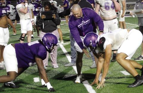 Greyhounds across multiple positions get ready to initiate contact during ‘board drills’ as part of spring practice. BRAD HARRISON/Staff