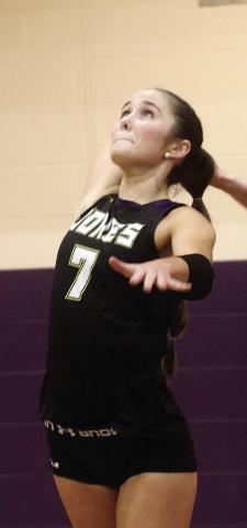Isabella Bodnarchuk forcefully serves the ball across the net during last Tuesday’s tri-match. BRAD HARRISON/Staff