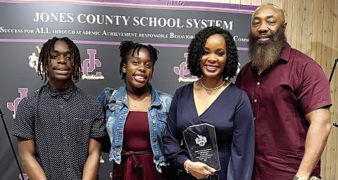 Charm Mapp with her family after being named Jones County Teacher of the Year. BETHANY TAPEE/Staff