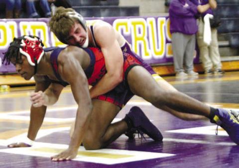 James Rackley maintains leverage against his onmat opponent during Tuesday’s match with Putnam County. BRAD HARRISON/ Staff