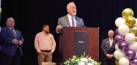 Georgia School Superintendent Richard Woods (at podium) speaks at Jones County High School Monday prior to distributing state academic achievement awards for 2024. DEBBIE LURIE-SMITH/Staff