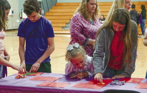 Students and their families do math activities during the Great Math and Science event to prepare for the GMAS. NATHAN CLARKE/Contributed