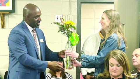 JCHS Principal Dennis Woolfolk presents Algebra I teacher Lisa Davis with flowers in honor of the receipt of the High Achievement Award. CONTRIBUTED