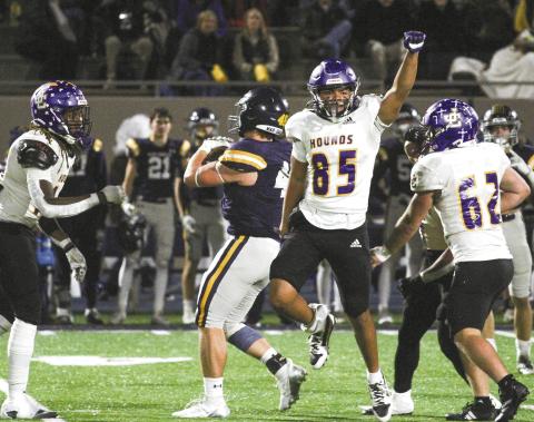 Corey Williams (85) celebrates as the Greyhounds defense takes down a Marist ball carrier behind the line of scrimmage during Friday’s state playoff game. Jones County’s upset bid fell short to the unbeaten and top-ranked War Eagles. SEE FULL COVERAGE IN SPORTS >> PAGE B1 BRAD HARRISON/Staff