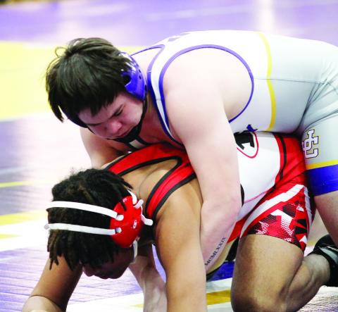 Brayden Thompson maintains leverage against his opponent during Saturday’s dual match against Dutchtown. BRAD HARRISON/Staff