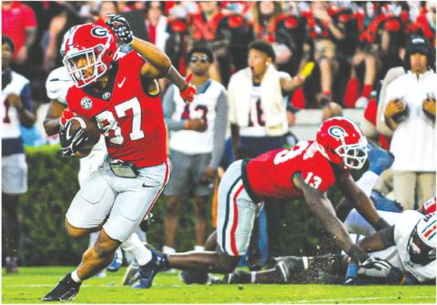 Georgia wide receiver Mehki Mews (87) breaks away from defenders on a 54-yard touchdown during Saturday’s win over UTMartin. CHARLES JORDAN/Contributed