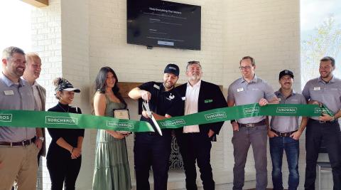Surcheros General Manager Wade Christian cut the ribbon Sept. 24 with franchise founder Luke Christian at his side. DEBBIE LURIE-SMITH/Staff