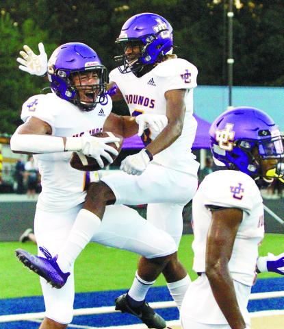 Jacob Jackson, left, celebrates with his teammates after scoring a _rst-quarter touchdown on Friday at Dacula. BRAD HARRISON/Staff