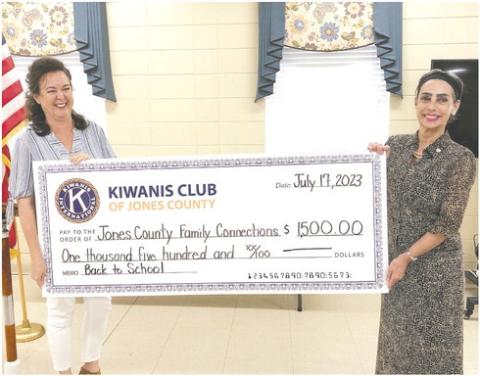 The Jones County Kiwanis Club donated $1500 to Jones County Family Connection to be used to buy book bags for Jones County school’s students. Kiwanis President Durrett Child’s made the presentation to Joy Carr (left). CONTRIBUTED