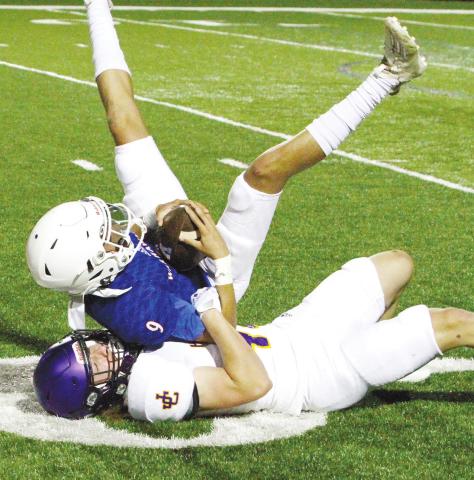 The Greyhounds defense came up with a number of open-field tackles to hold the Warhawks to a pair of offensive touchdowns on Friday. BRAD HARRISON/Staff