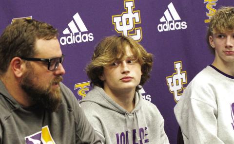 Greyhound wrestlers look on as head coach Adam Gillhouse previews the season. BRAD HARRISON/Staff
