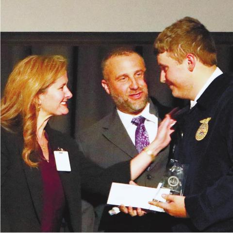 Tyler Poythress receiving his award as the CTAE student of the year from Lance and Laura Rackley. NATHAN CLARKE/Contributed
