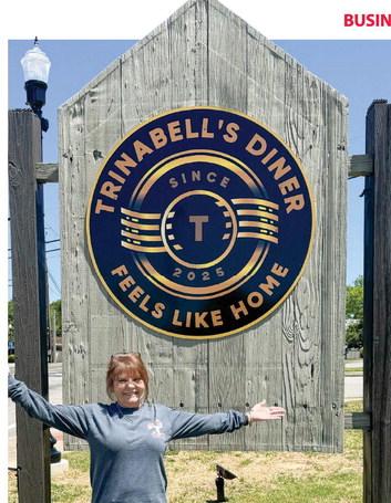 Trina Earwood Hathway in front her restaurant Trinabell’s Diner sign that had its grand opening Saturday. Contributed